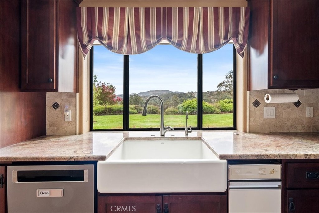 2955 San Fernando Road Atascadero, CA 93422 - Photo 18 of 62 a kitchen with a sink and a stove top oven