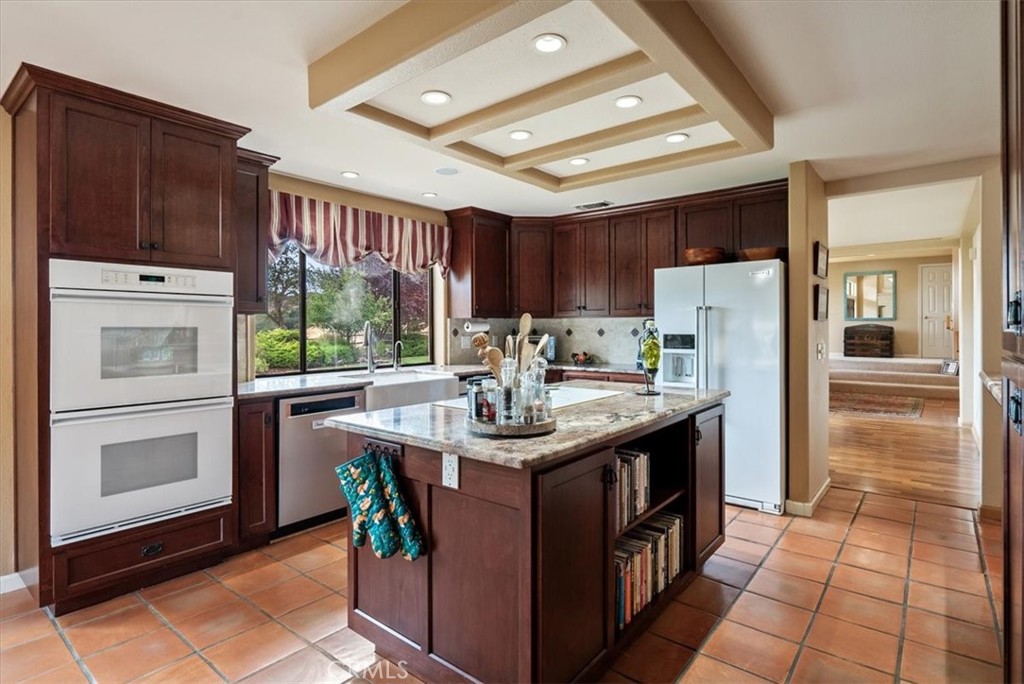 2955 San Fernando Road Atascadero, CA 93422 - Photo 19 of 62 a kitchen with stainless steel appliances granite countertop a sink stove and refrigerator