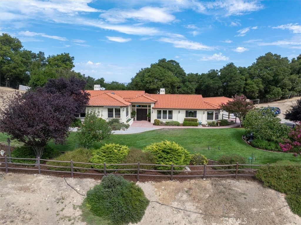 2955 San Fernando Road Atascadero, CA 93422 - Photo 2 of 62 a front view of a house with a garden