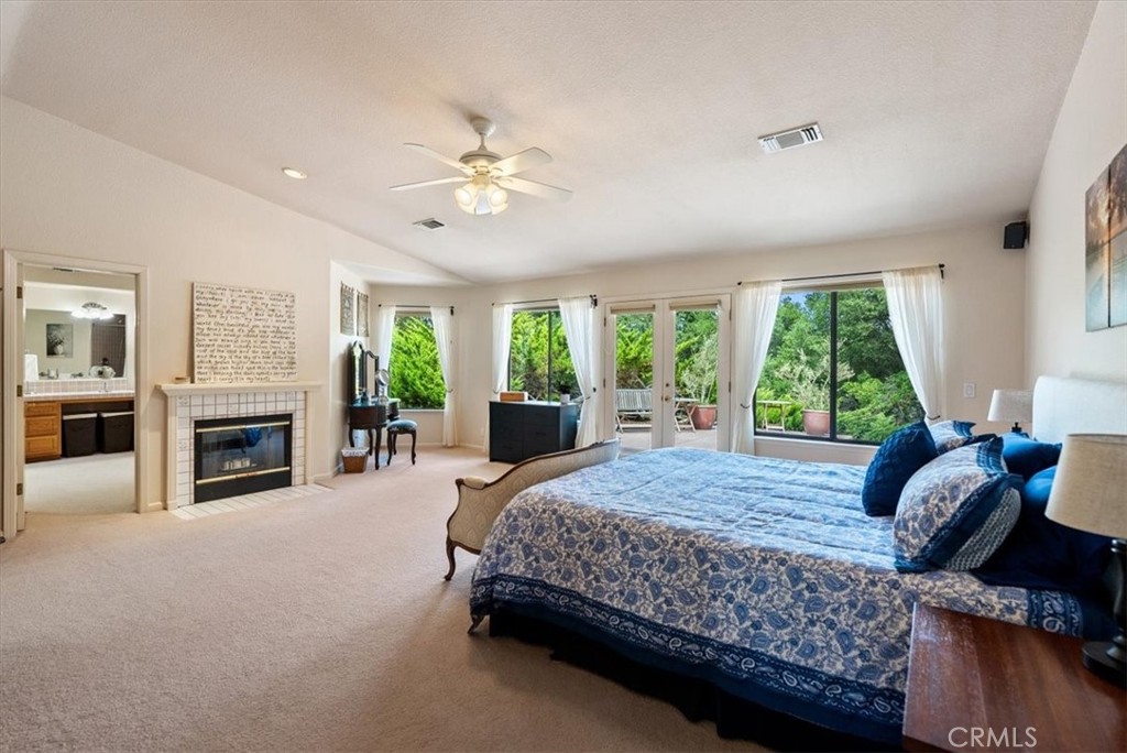 2955 San Fernando Road Atascadero, CA 93422 - Photo 25 of 62 a bed room with a bed and a fireplace
