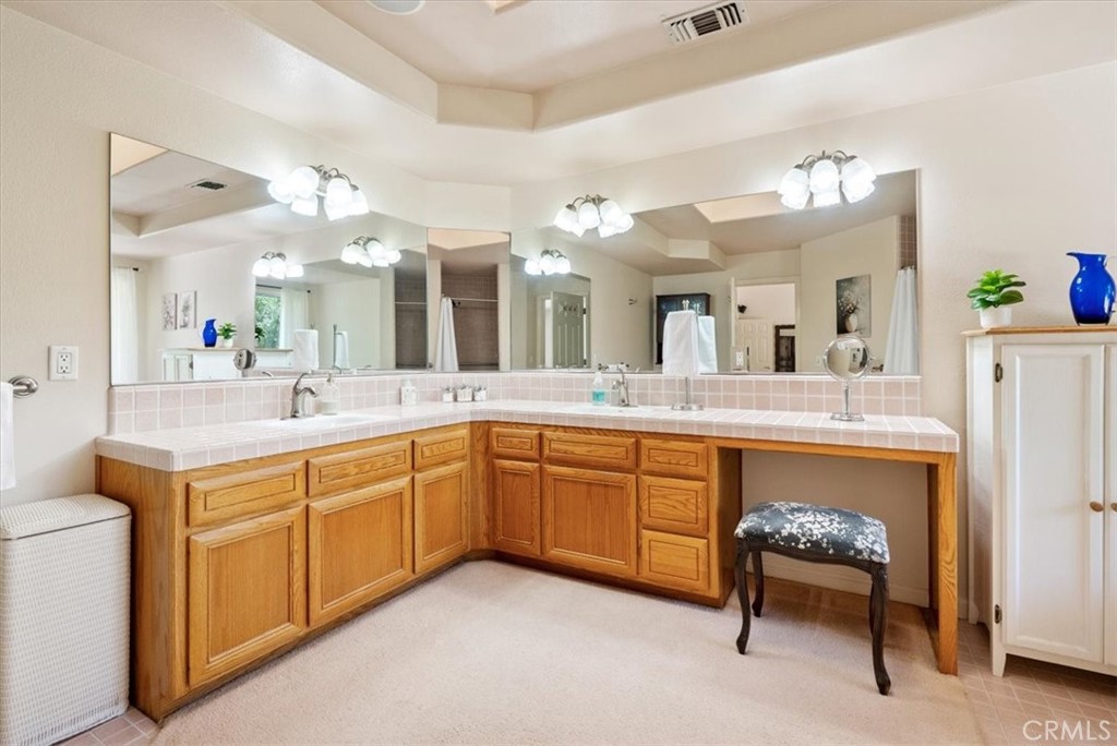 2955 San Fernando Road Atascadero, CA 93422 - Photo 27 of 62 a spacious bathroom with a double vanity sink and a mirror