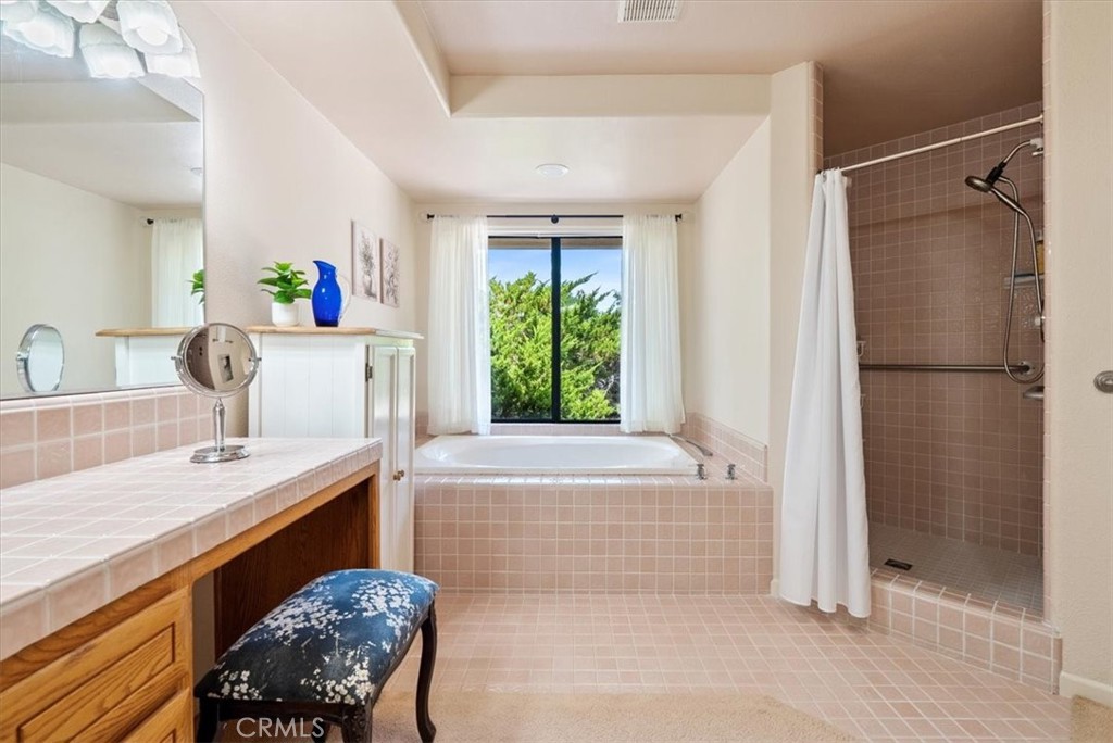 2955 San Fernando Road Atascadero, CA 93422 - Photo 28 of 62 a bathroom with a tub shower and sink