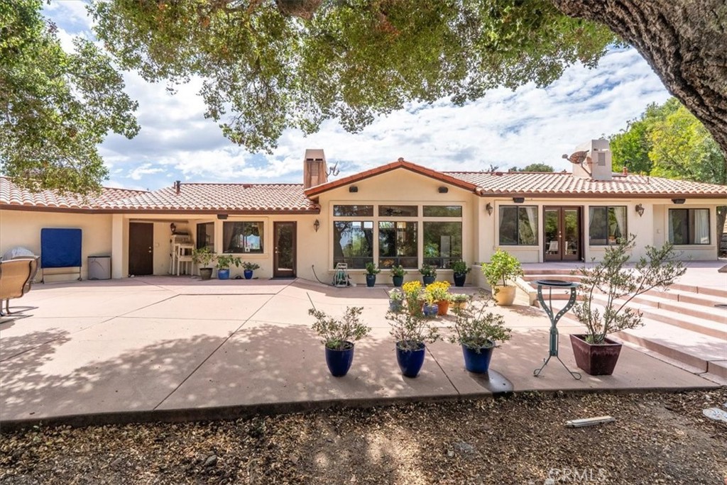 2955 San Fernando Road Atascadero, CA 93422 - Photo 37 of 62 a front view of a house with a yard and seating space