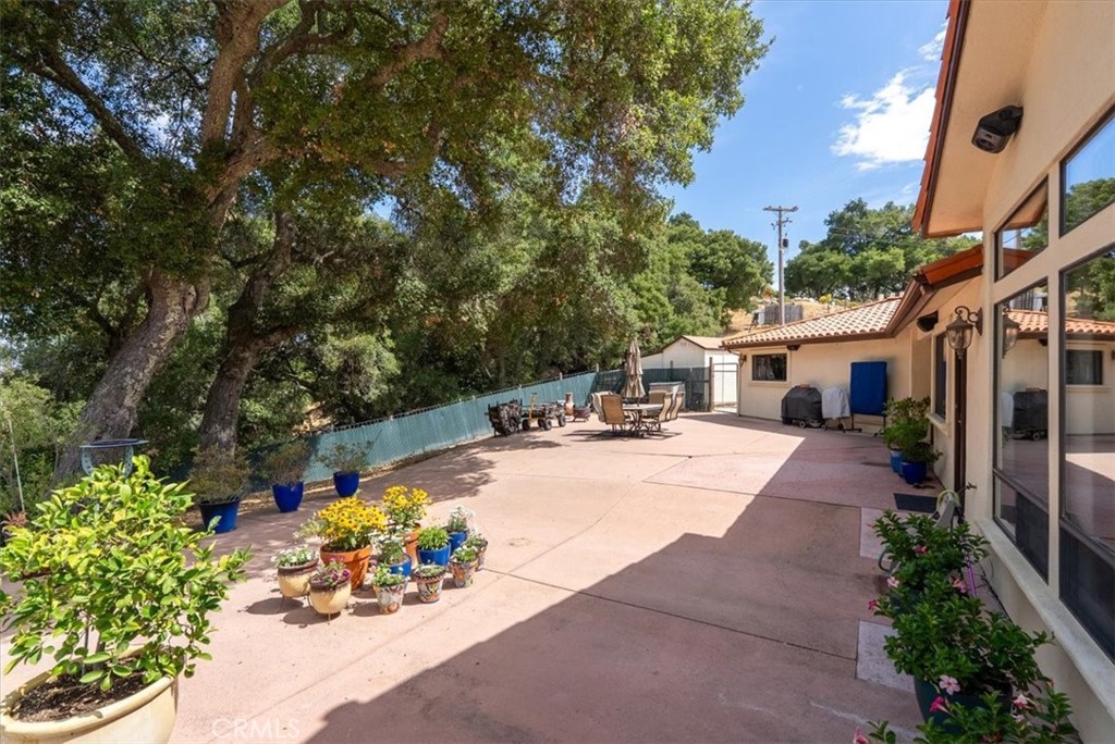 2955 San Fernando Road Atascadero, CA 93422 - Photo 42 of 62 a view of a patio with couches and table and chairs under an umbrella