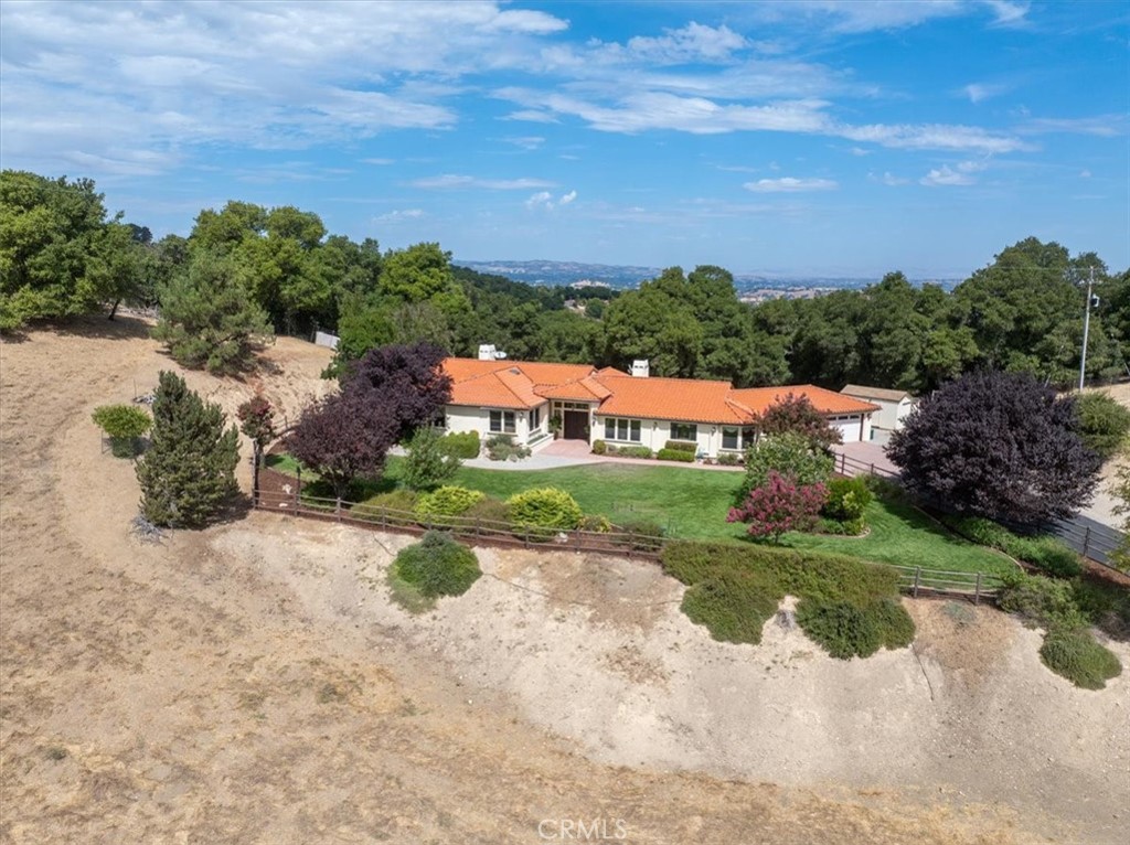 2955 San Fernando Road Atascadero, CA 93422 - Photo 43 of 62 a view of a garden with a building in the background