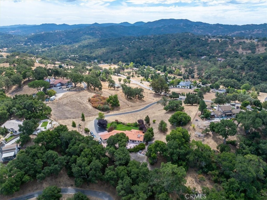 2955 San Fernando Road Atascadero, CA 93422 - Photo 45 of 62 an aerial view of green landscape with trees houses and mountain view
