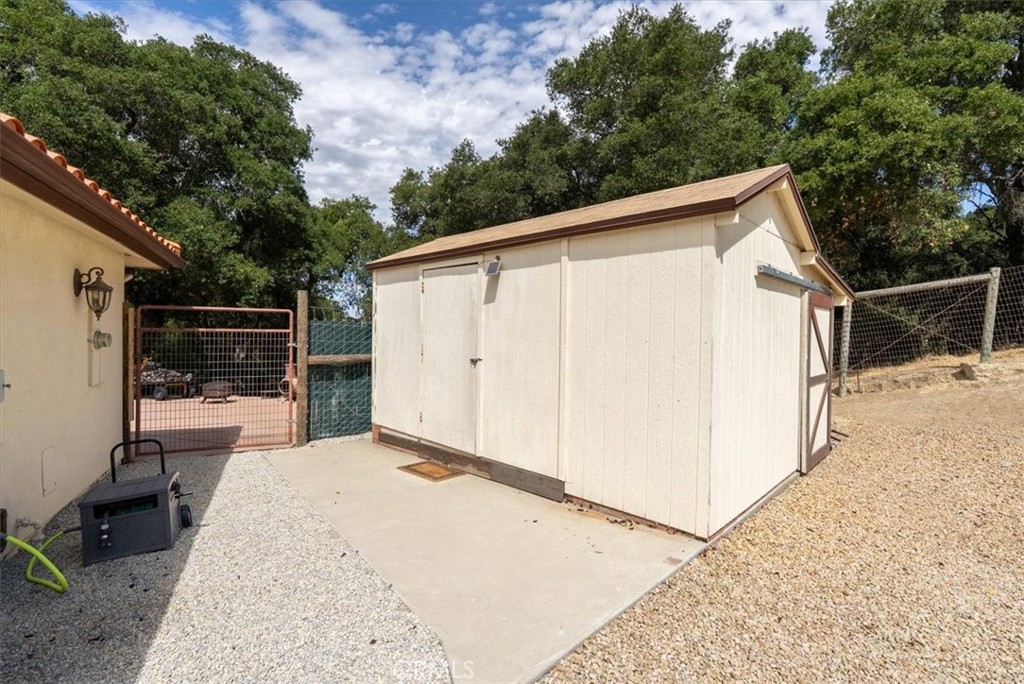 2955 San Fernando Road Atascadero, CA 93422 - Photo 51 of 62 a view of backyard with large trees and wooden fence