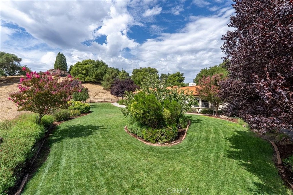 2955 San Fernando Road Atascadero, CA 93422 - Photo 53 of 62 a view of a garden with a building in the background