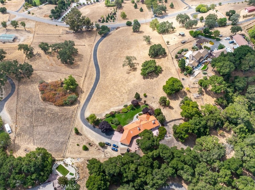 2955 San Fernando Road Atascadero, CA 93422 - Photo 62 of 62 an aerial view of a golf course with a white house