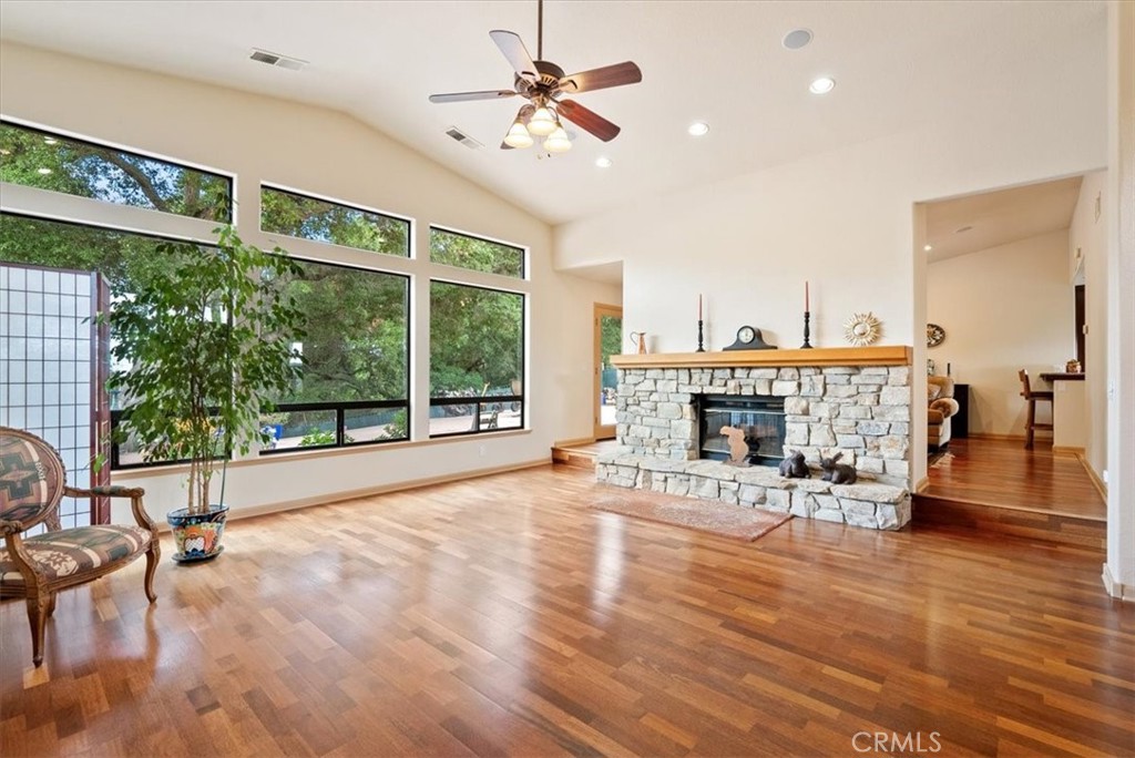 2955 San Fernando Road Atascadero, CA 93422 - Photo 8 of 62 a living room with furniture a fireplace and a floor to ceiling window