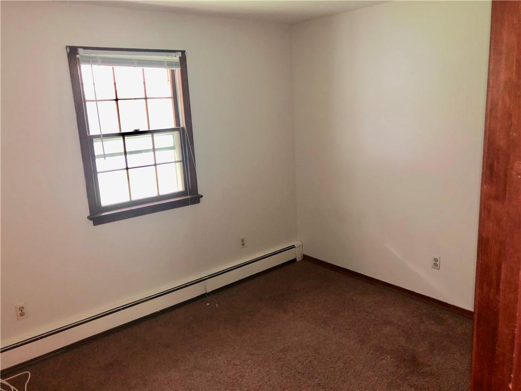 236 Creek Road Poughkeepsie, NY 12601 - Photo 12 of 18 Carpeted spare room with a baseboard radiator and a healthy amount of sunlight