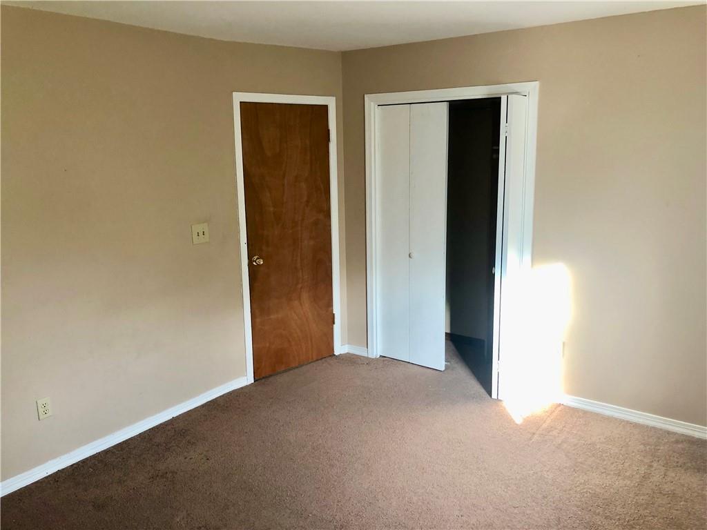 236 Creek Road Poughkeepsie, NY 12601 - Photo 13 of 18 Unfurnished bedroom with a closet and carpet floors