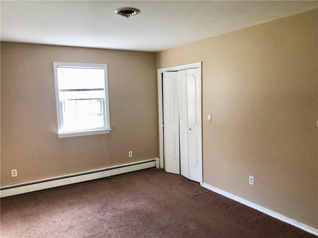236 Creek Road Poughkeepsie, NY 12601 - Photo 16 of 18 Unfurnished bedroom featuring dark colored carpet and a baseboard heating unit