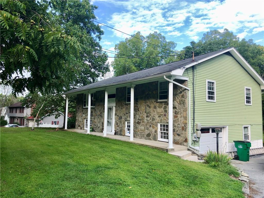 236 Creek Road Poughkeepsie, NY 12601 - Photo 2 of 18 View of front facade featuring a garage and a front yard