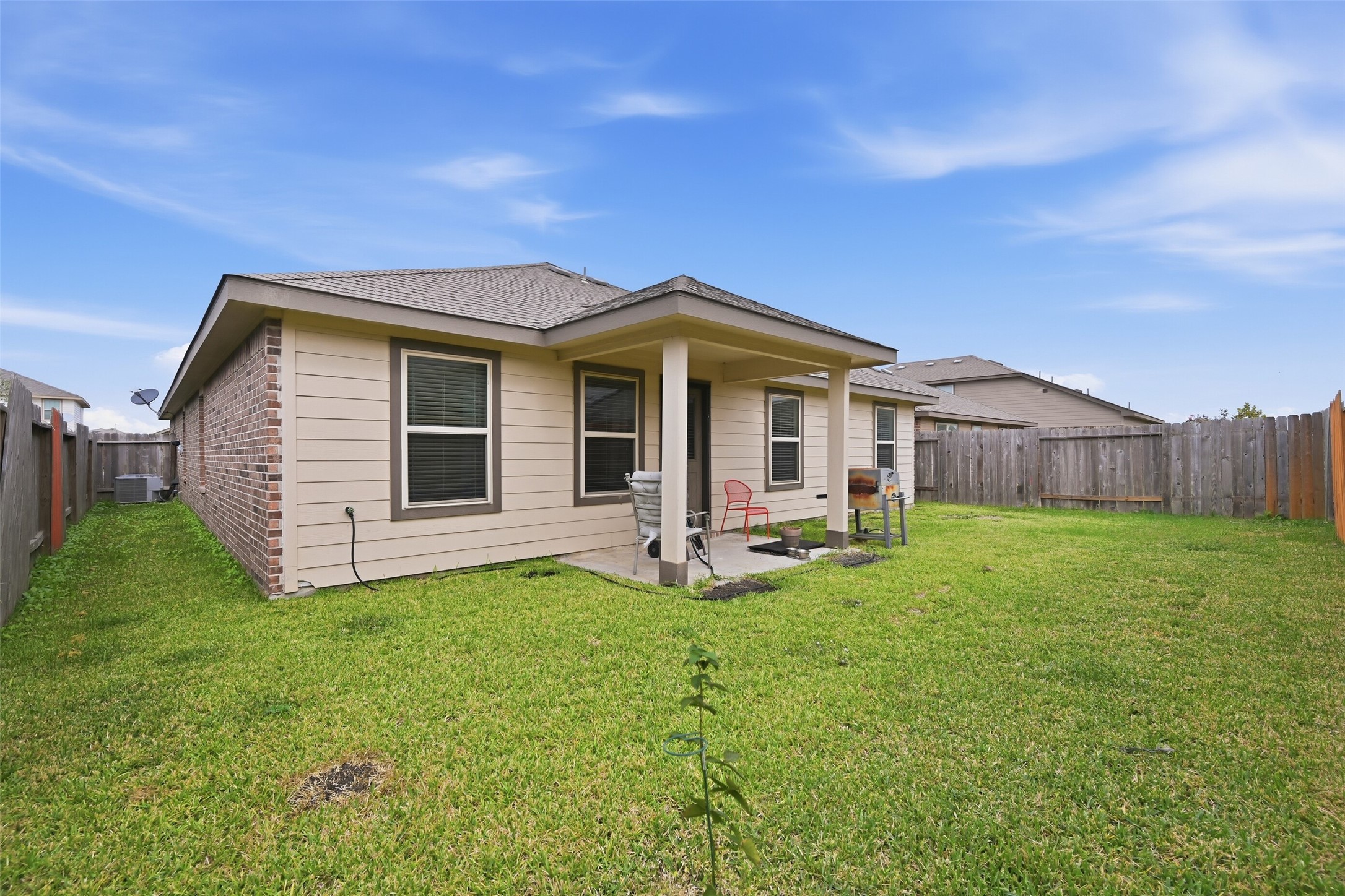 714 Calm Court Rosharon, TX 77583 - Photo 30 of 33 Covered patio overlooking the backyard, ideal for grilling or relaxing outdoors.