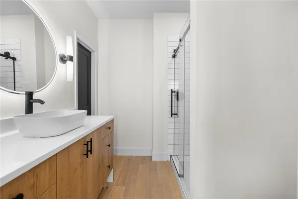 a bathroom with a sink and a mirror