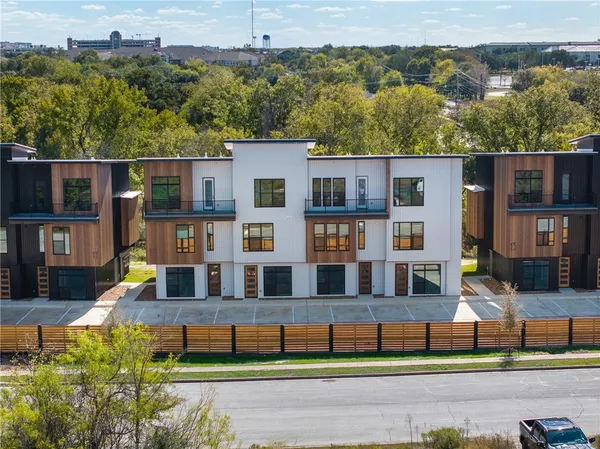 a view of house with a yard