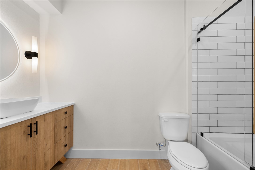2539 East Villa Maria Road, Unit 11D Bryan, TX 77802 - Photo 23 of 38 a white toilet sitting next to a bathroom sink