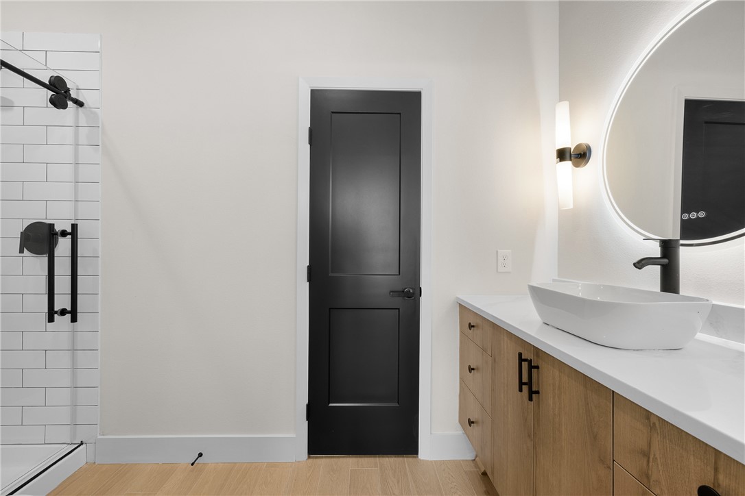 2539 East Villa Maria Road, Unit 11D Bryan, TX 77802 - Photo 6 of 38 a bathroom with a sink and a mirror