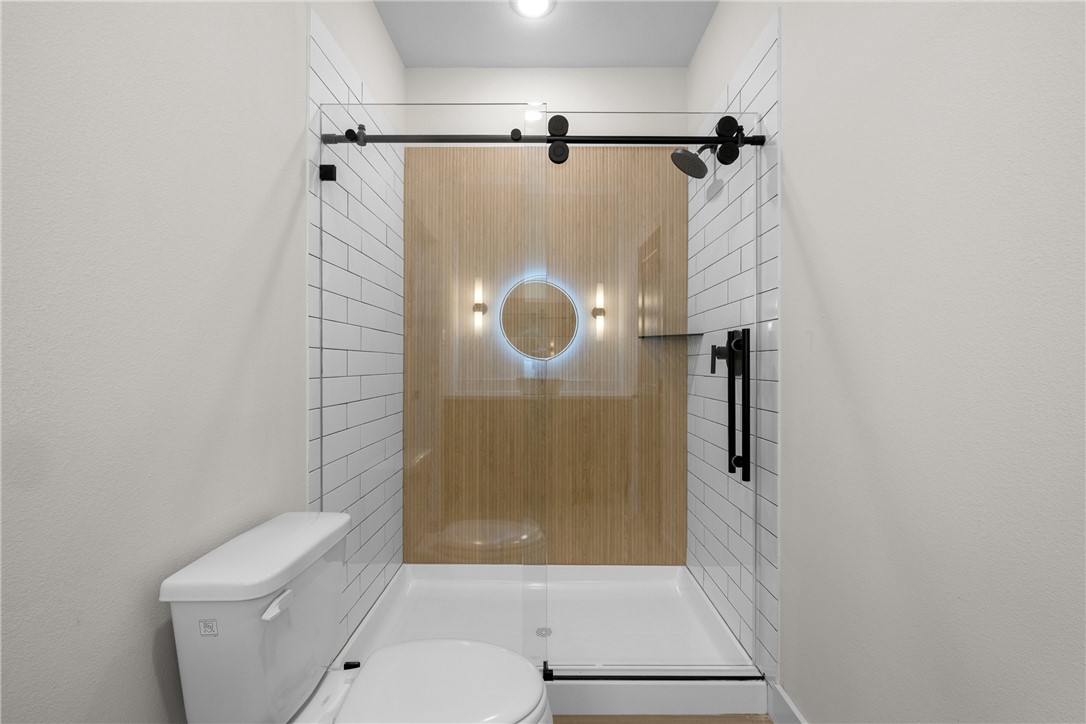 2539 East Villa Maria Road, Unit 11D Bryan, TX 77802 - Photo 7 of 38 a bathroom with a shower toilet and sink