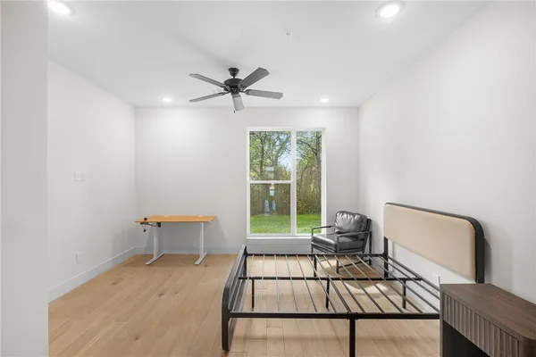 a view of a livingroom with furniture and a workspace