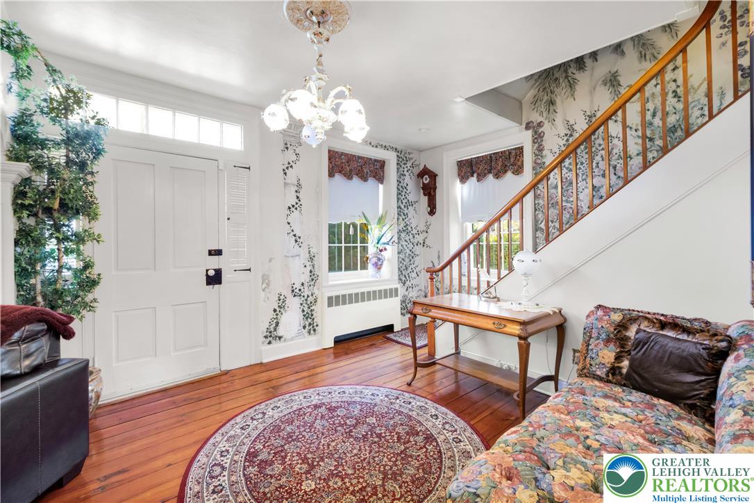 1742 Butztown Road Bethlehem, PA 18017 - Photo 19 of 56 Light-filled, expansive foyer showcases the staircase to the 2nd floor, hand-painted mural and beautiful wood floors