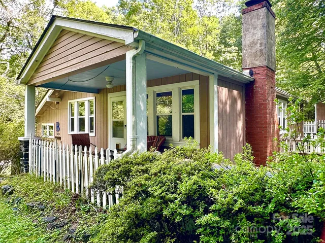 a view of a house with a flower garden