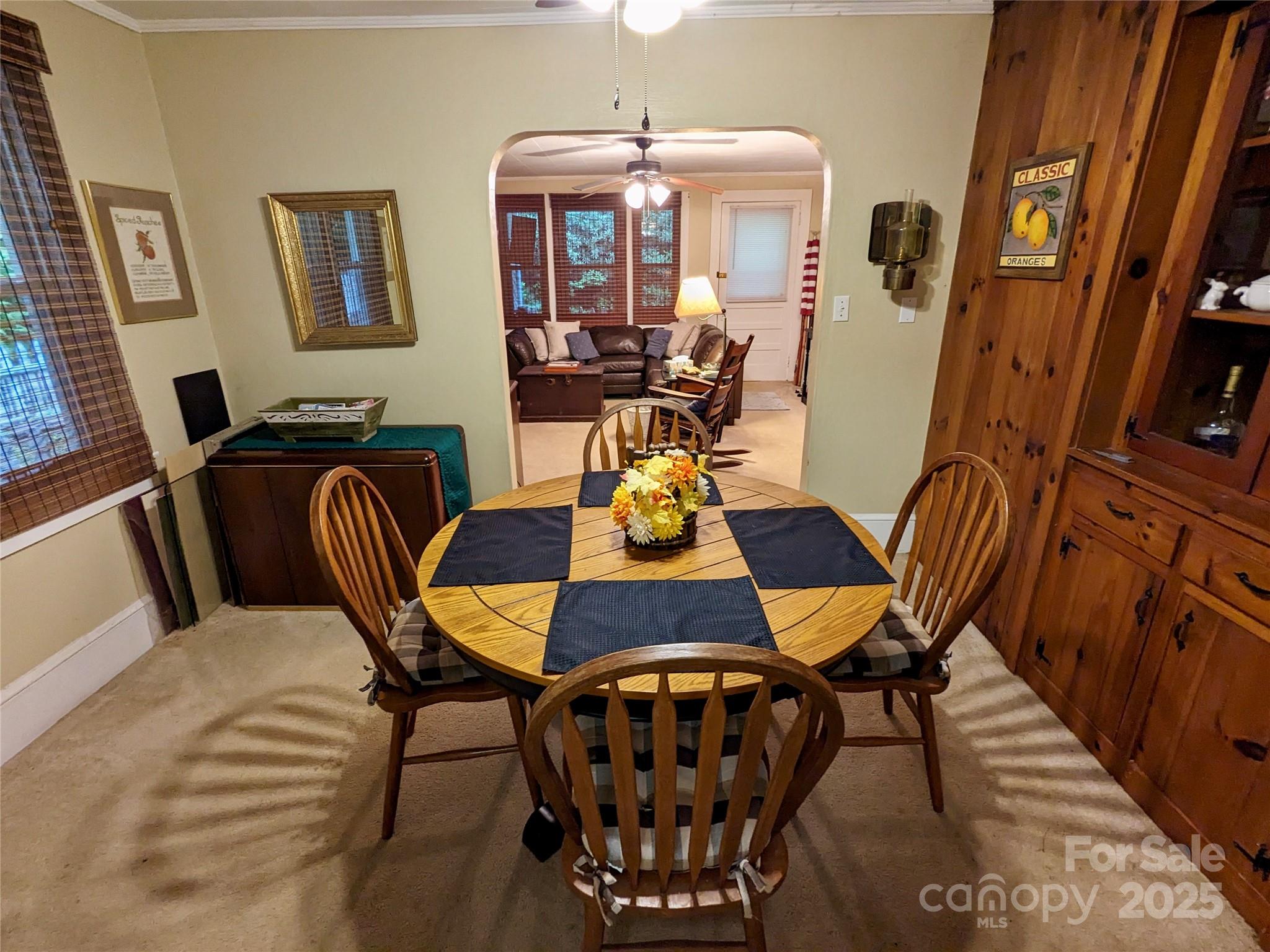 46 Tree Farm Road Spruce Pine, NC 28777 - Photo 11 of 40 a view of a dining room with furniture and wooden floor