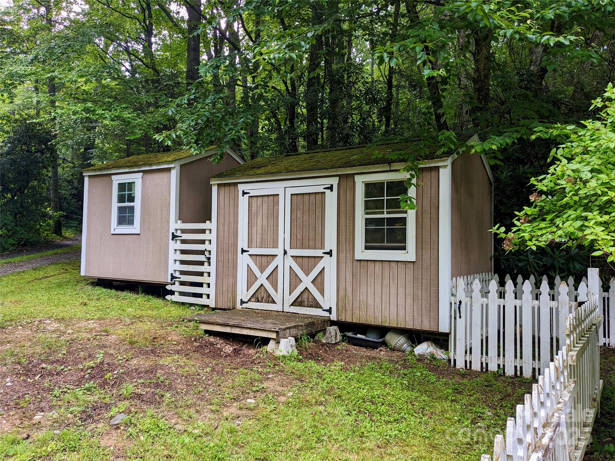 46 Tree Farm Road Spruce Pine, NC 28777 - Photo 24 of 40 front view of a house with a yard