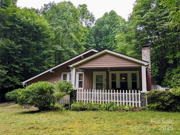 a view of front of house with a yard