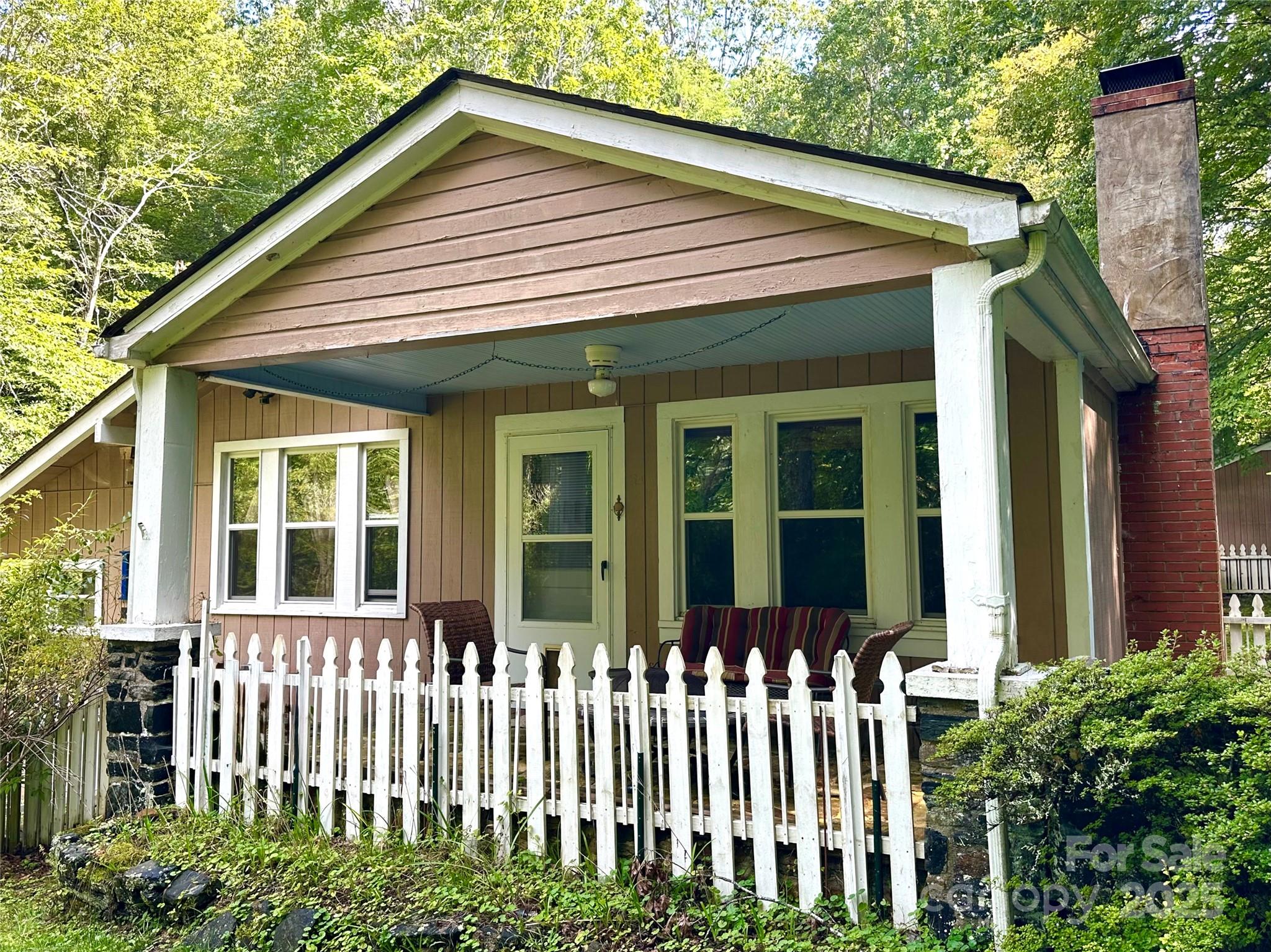 46 Tree Farm Road Spruce Pine, NC 28777 - Photo 35 of 40 a front view of a house with a garden