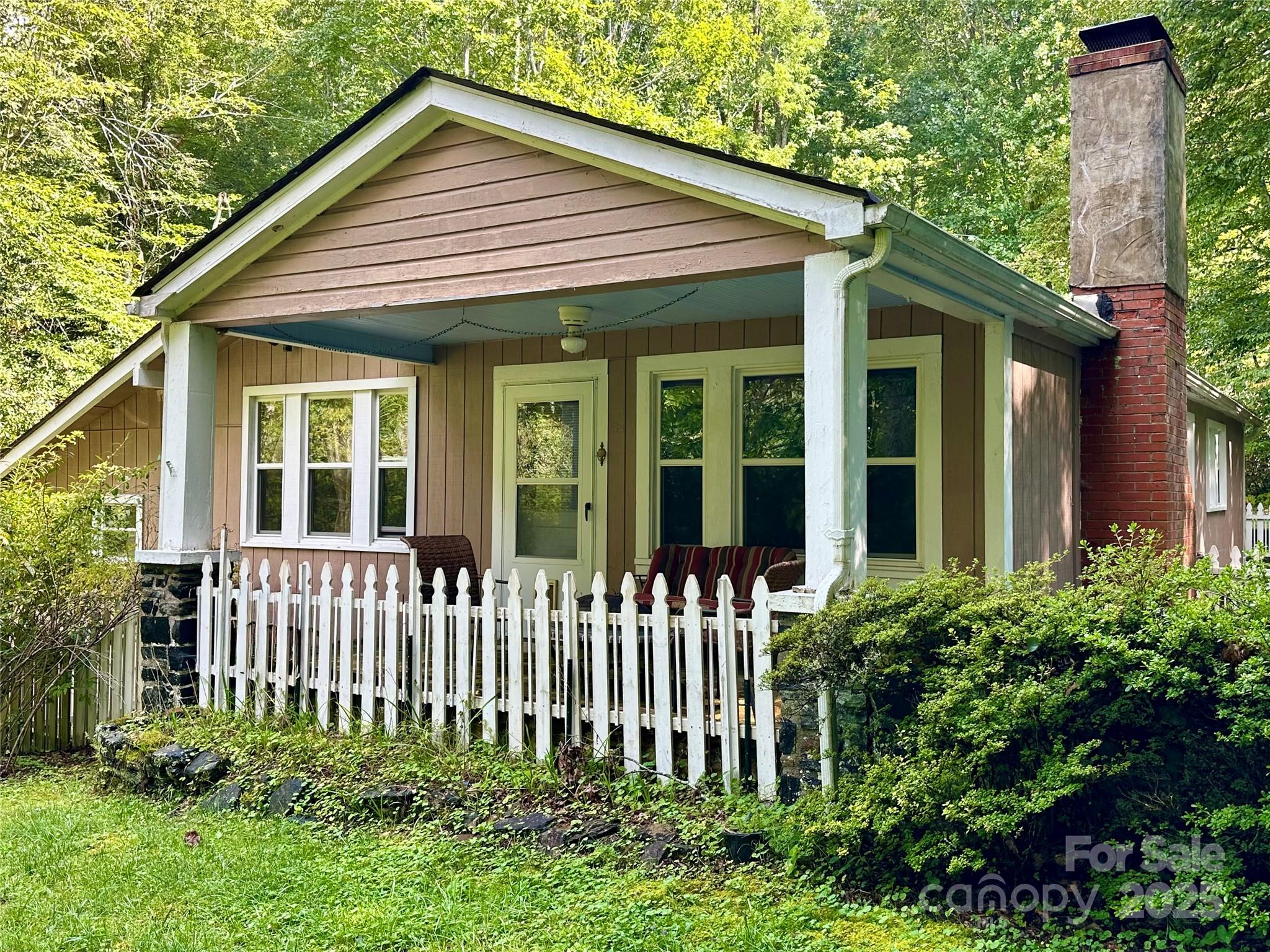 46 Tree Farm Road Spruce Pine, NC 28777 - Photo 38 of 40 a front view of a house with a garden