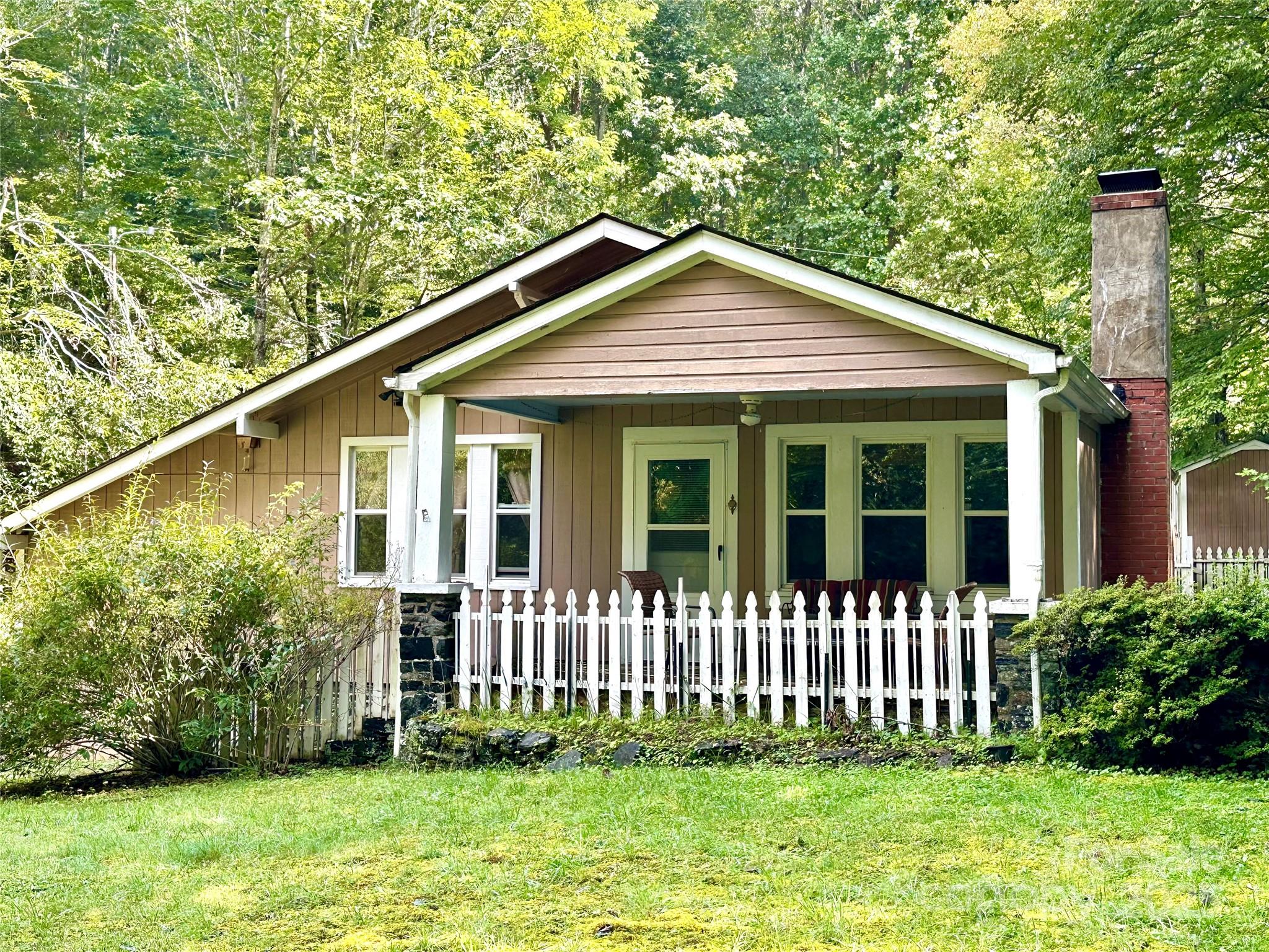 46 Tree Farm Road Spruce Pine, NC 28777 - Photo 39 of 40 a front view of a house with a garden