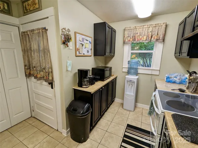 a kitchen with a stove and a refrigerator
