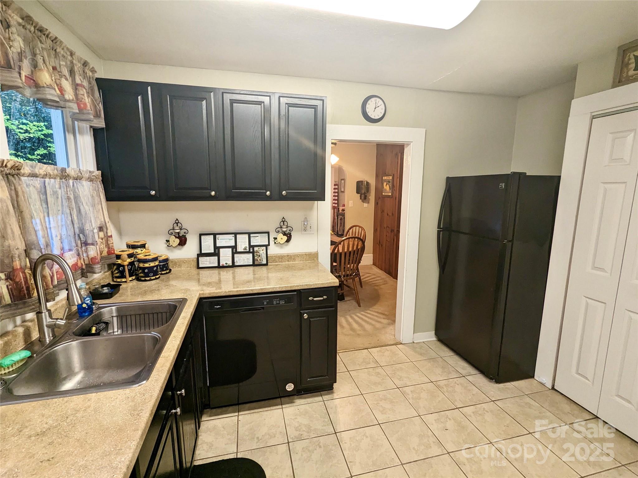 46 Tree Farm Road Spruce Pine, NC 28777 - Photo 5 of 40 a kitchen with stainless steel appliances granite countertop a refrigerator and a sink