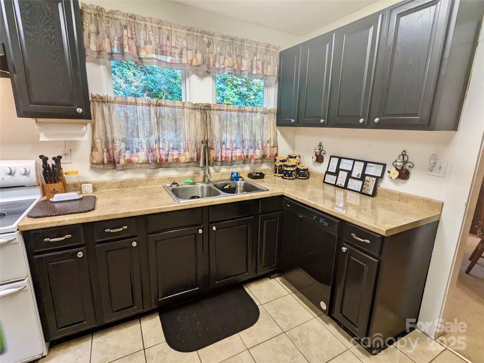 46 Tree Farm Road Spruce Pine, NC 28777 - Photo 6 of 40 a kitchen with a sink cabinets and a window