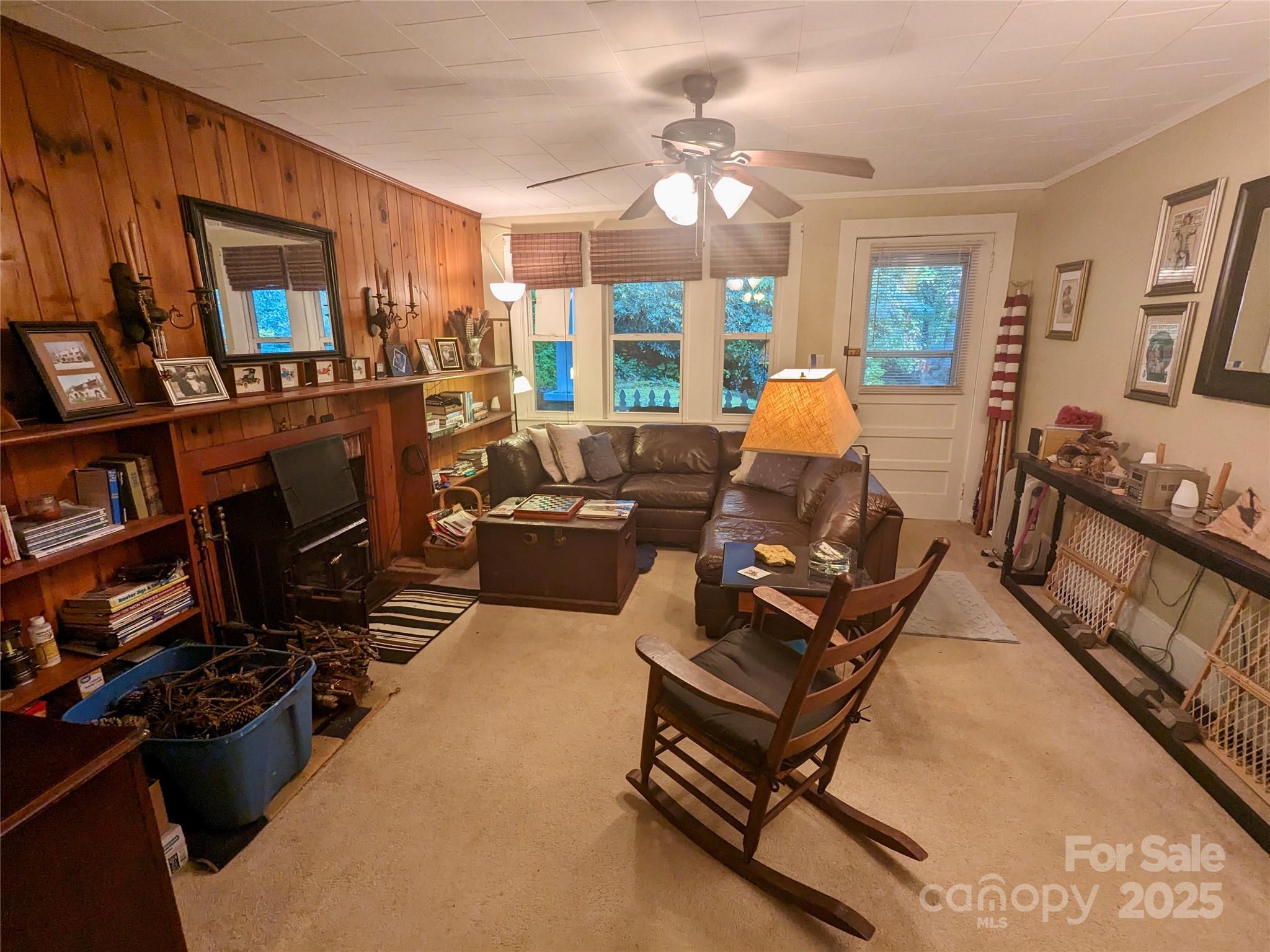 46 Tree Farm Road Spruce Pine, NC 28777 - Photo 7 of 40 a living room with furniture fireplace and a large window
