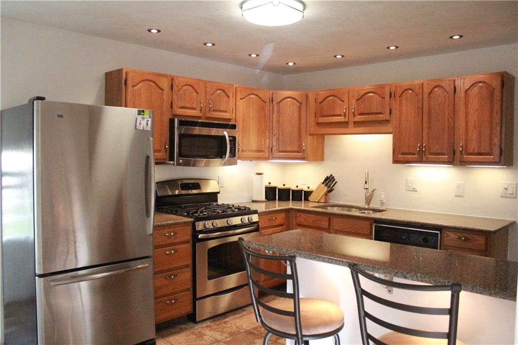 2622 Reiter Road Penn Hills, PA 15235 - Photo 3 of 21 Eat-In Kitchen with new stainless fridge, microwave and oven.