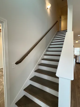 a view of a livingroom with a ceiling fan window and entryway
