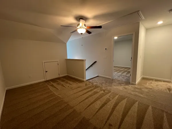 a view of a room with a fan
