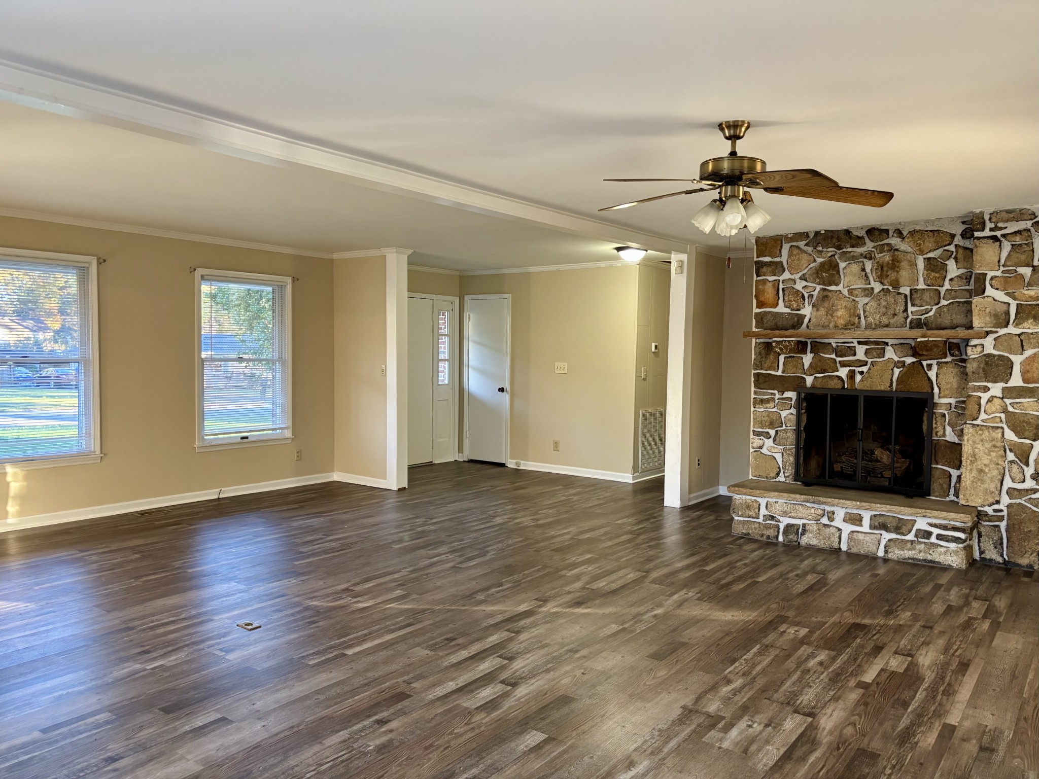 218 Greenfield Avenue Tullahoma, TN 37388 - Photo 2 of 14 a view of an empty room with a fireplace and window