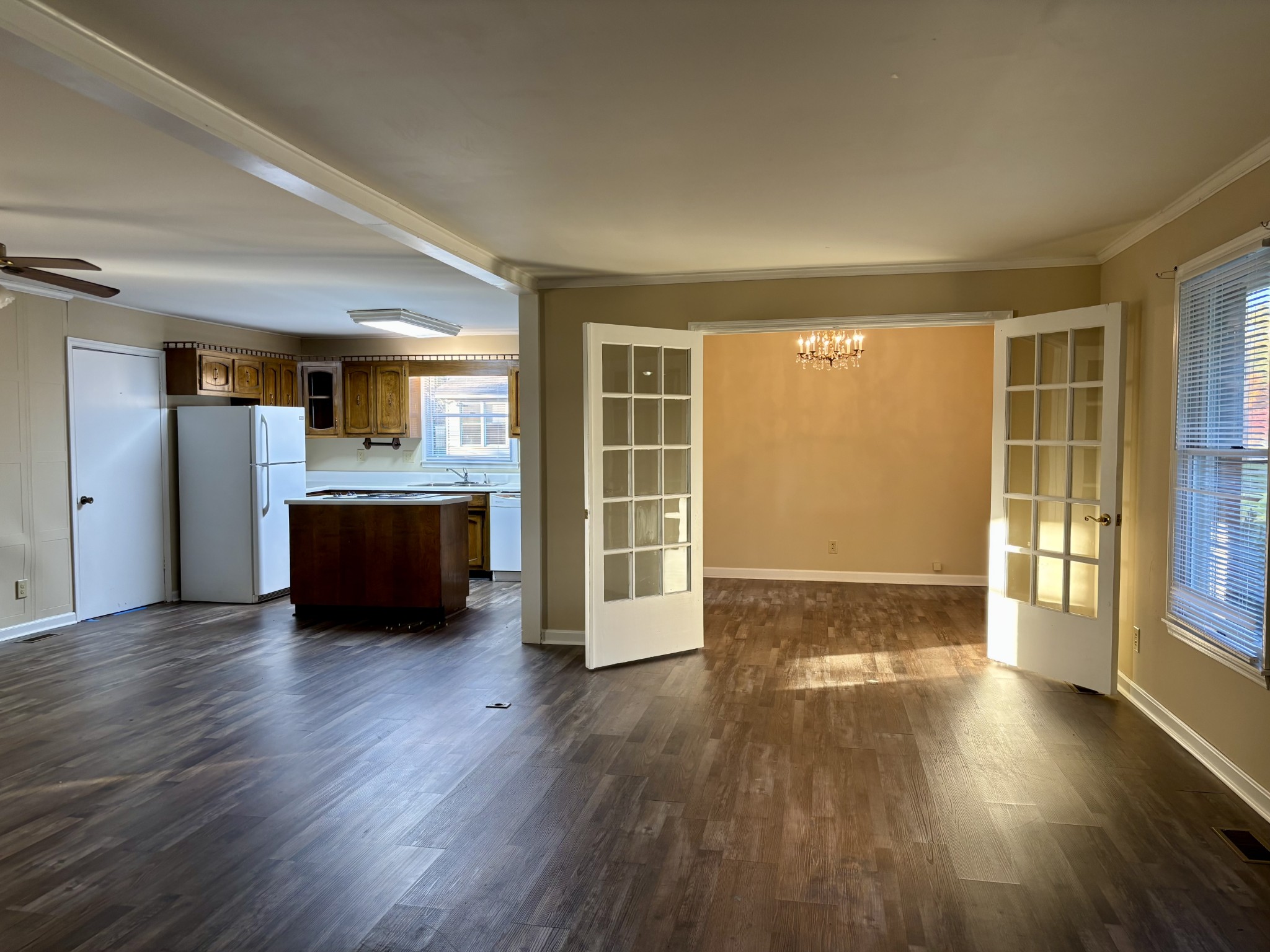 218 Greenfield Avenue Tullahoma, TN 37388 - Photo 3 of 14 a view of an empty room with wooden floor and a window