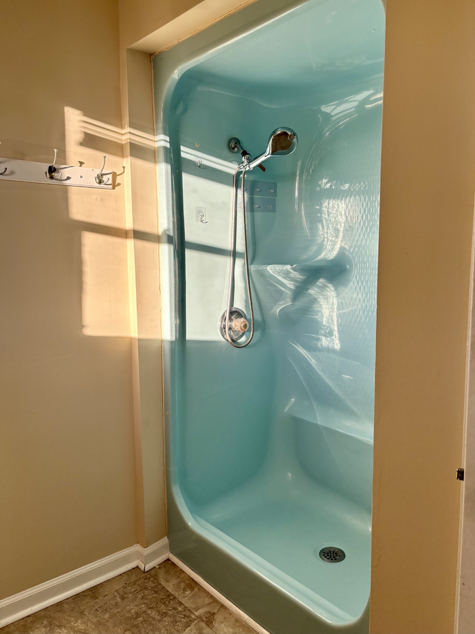 218 Greenfield Avenue Tullahoma, TN 37388 - Photo 7 of 14 a bathroom with a glass shower door