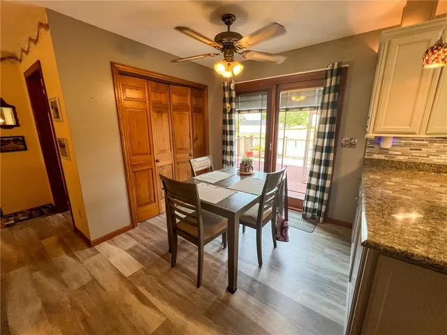 a view of a dining room with furniture and a window