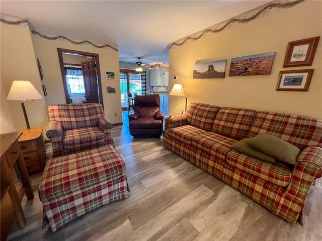 a bedroom with furniture and wooden floor