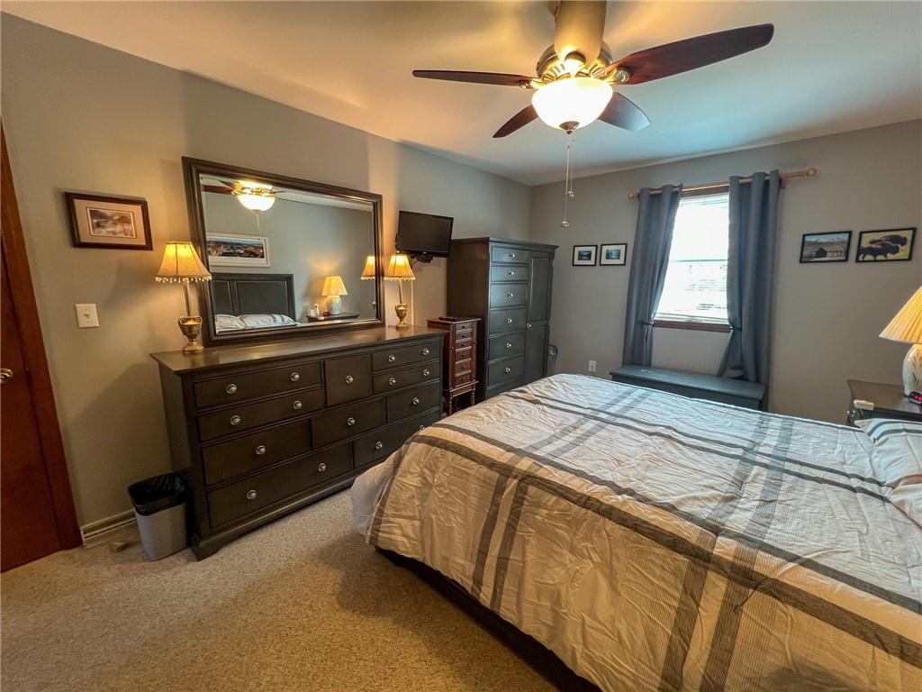 100 Marion Drive Butler, PA 16001 - Photo 17 of 45 a bedroom with a bed and a chandelier