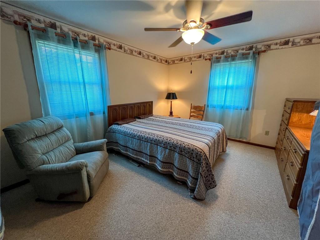 100 Marion Drive Butler, PA 16001 - Photo 19 of 45 a bedroom with a bed couch and a window