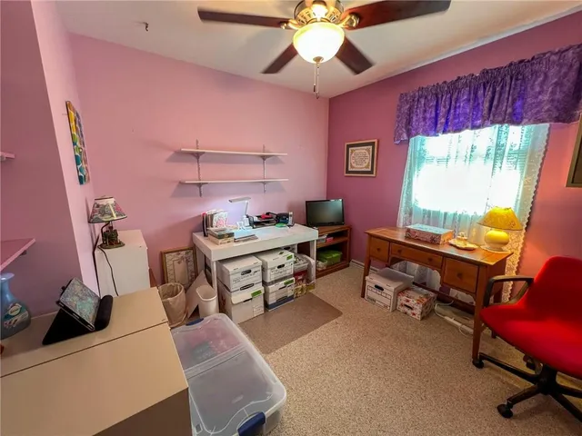 a bedroom with furniture and a window