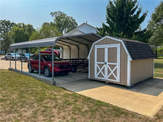 a view of a car park in front of house
