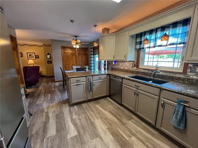 a kitchen with lots of counter top space and a sink